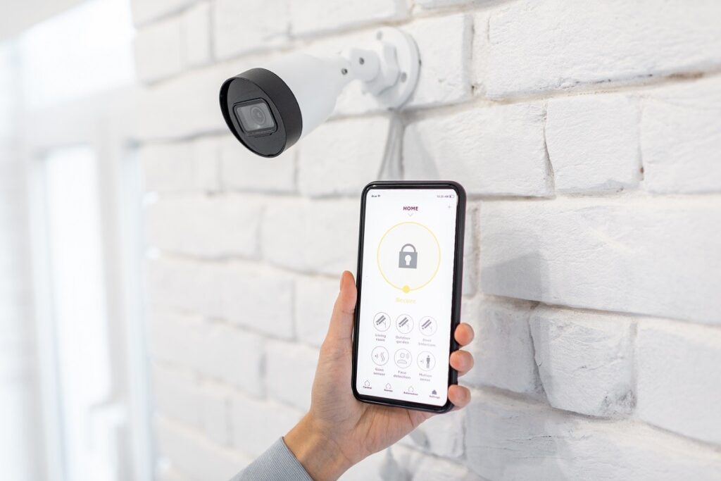 a homeowner testing their app and smart camera connection