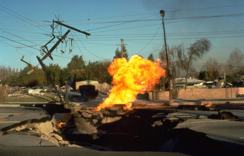 a fire in the middle of a road following the Northridge earthquake