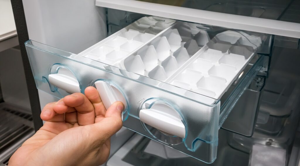 an empty ice cube tray in a freezer