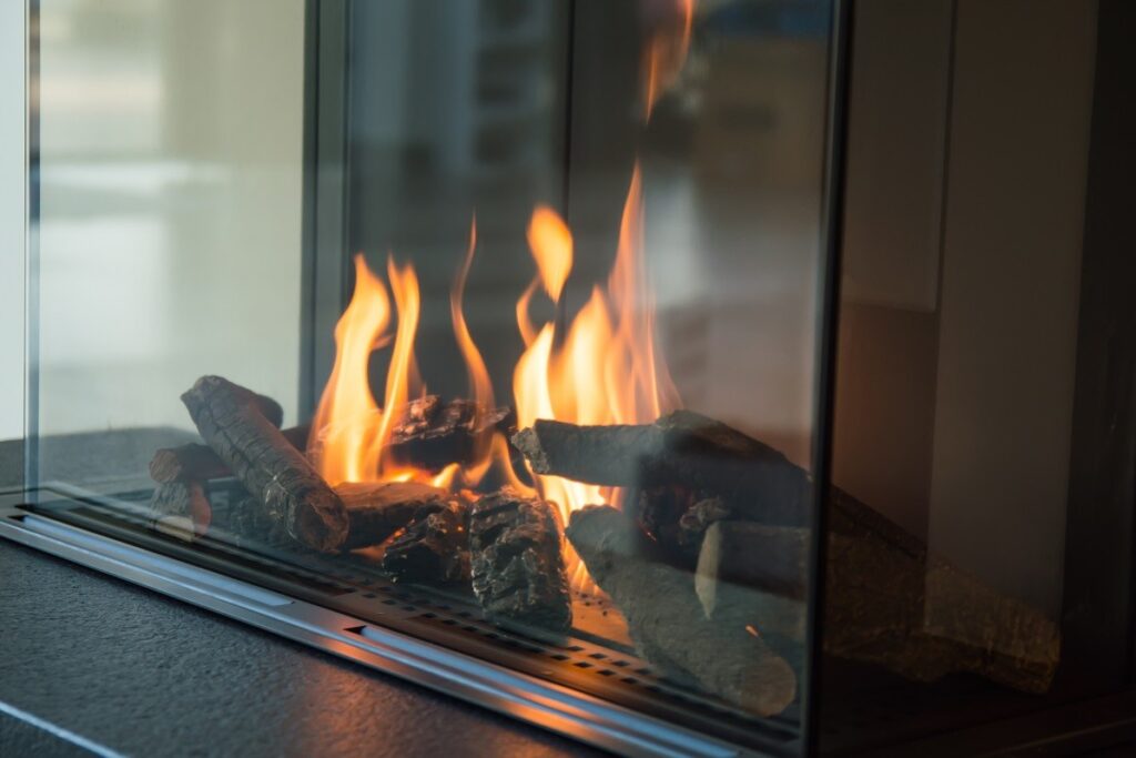 a gas fireplace inside a living room - gas fireplace leak symptoms