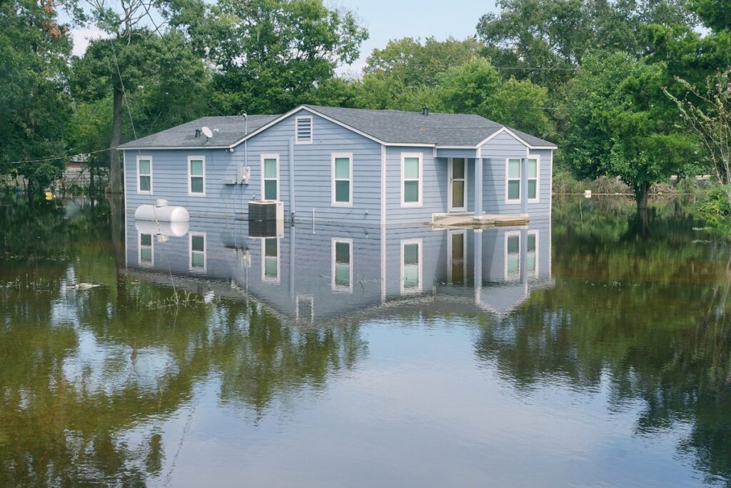 a home surrounded by flood waters