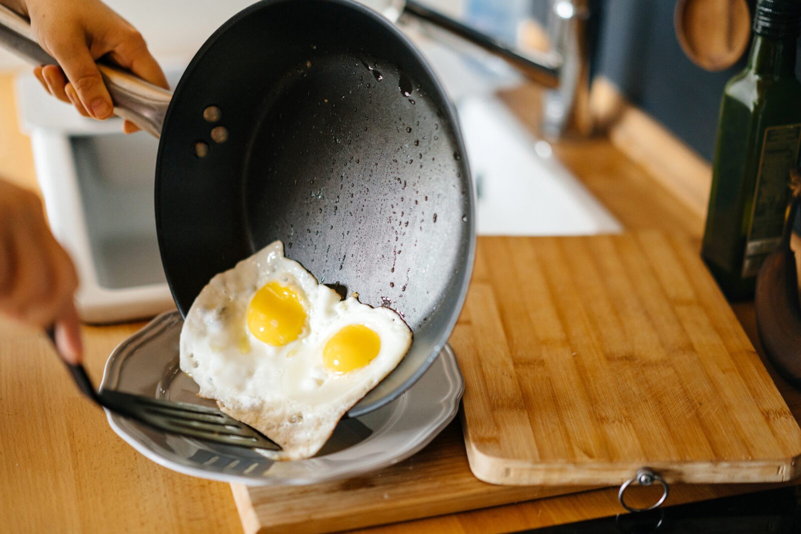 eggs sunnyside up in a non-stick pan, which may have PFAS chemicals