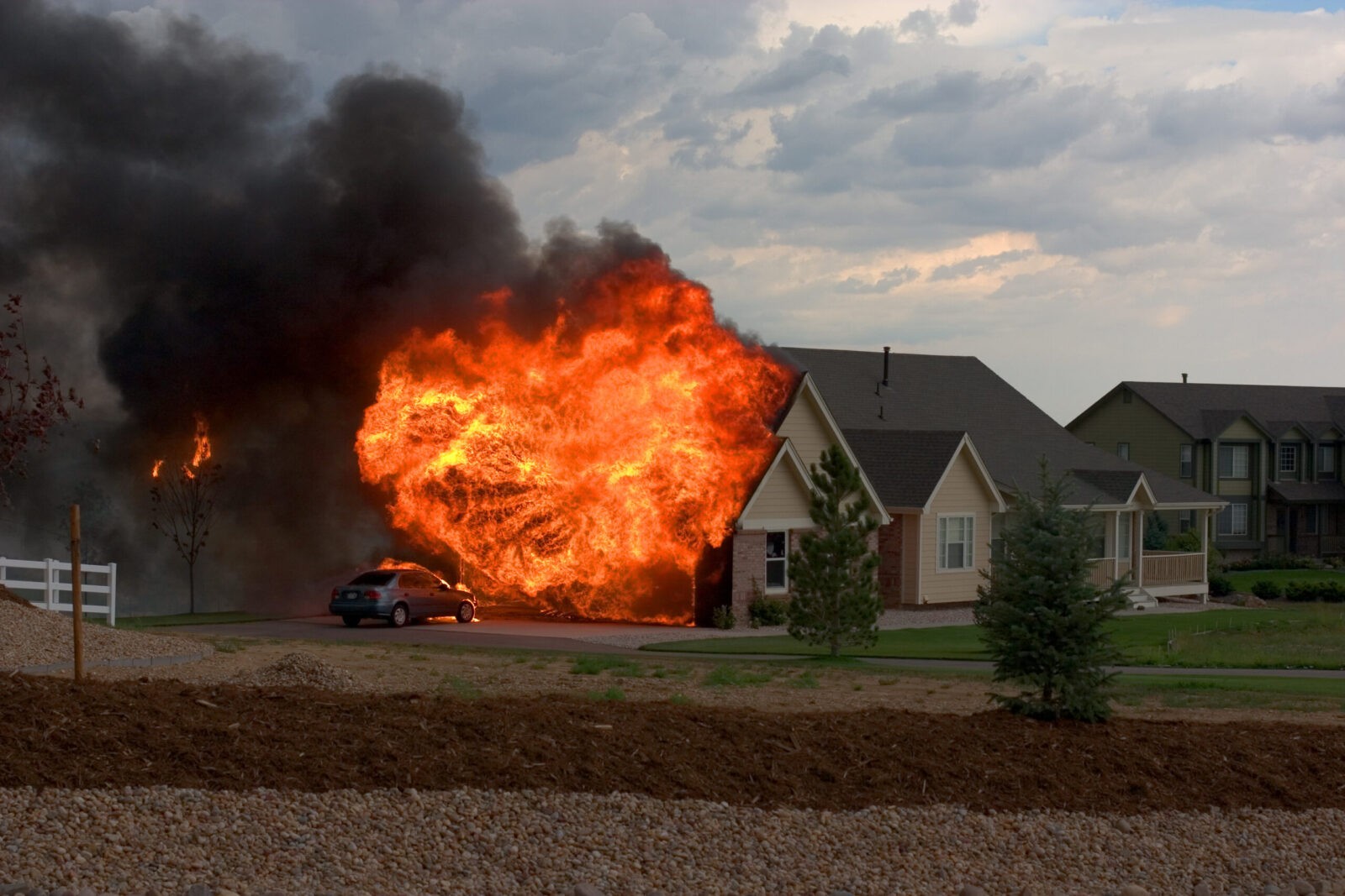 a fire coming out of a home garage