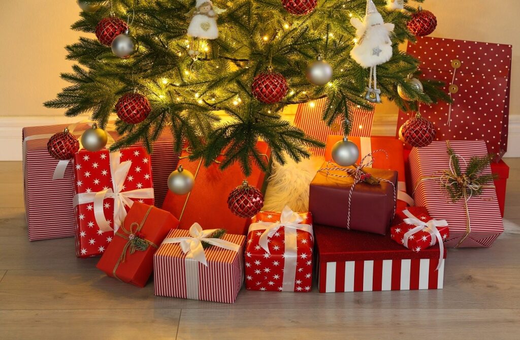 Christmas tree with presents underneath - tips to keep your home safe from burglars