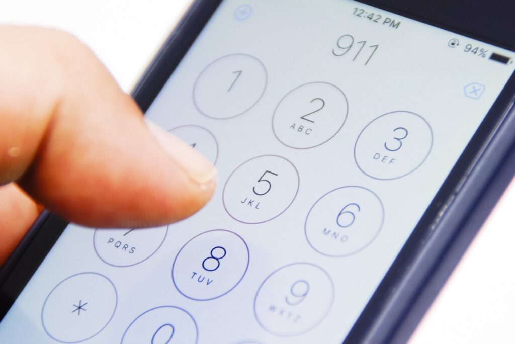 closeup of cell phone calling 911