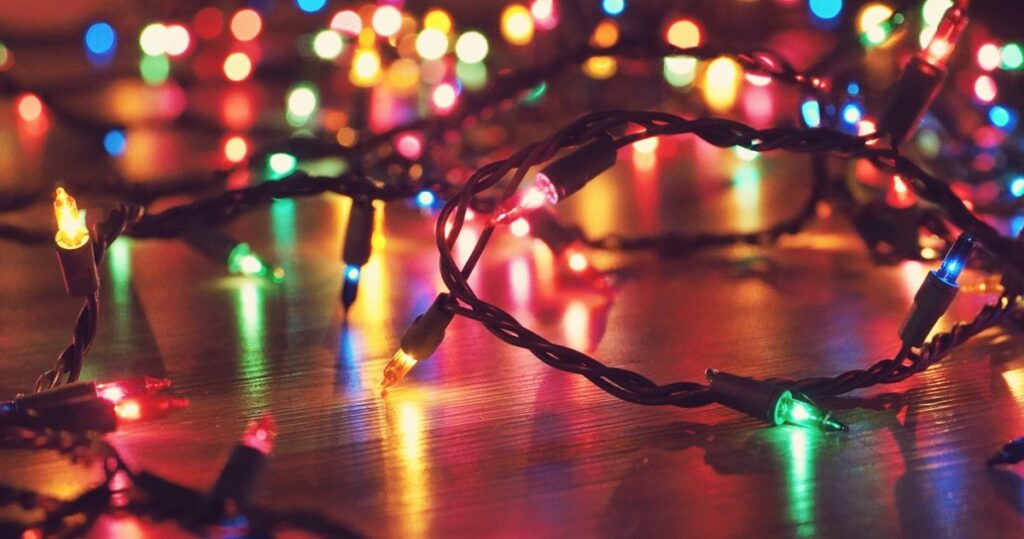 Multi-colored holiday lights lit on the floor 