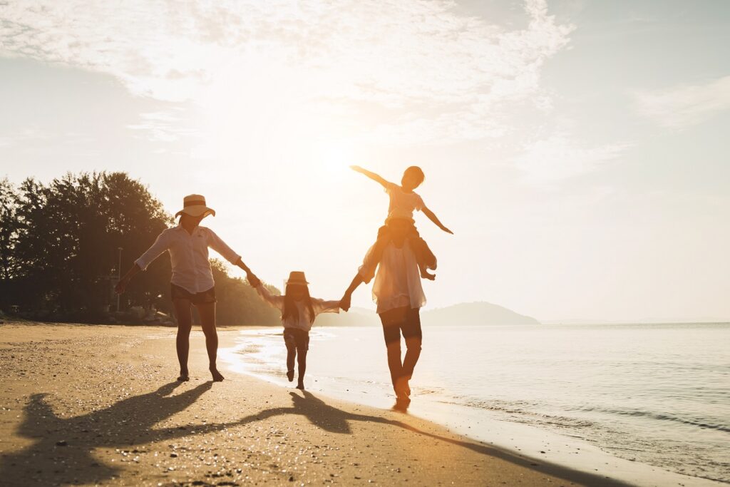 a family on vacation on a beach