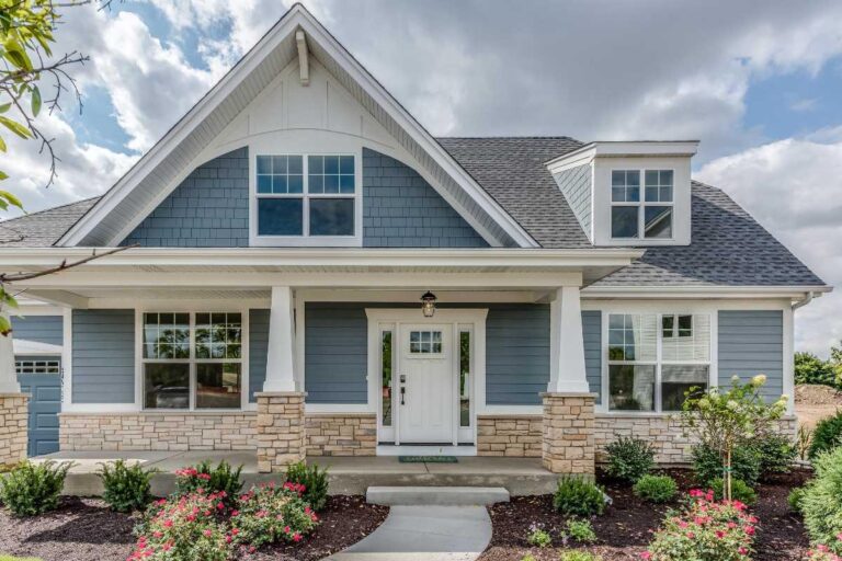 a well-maintained blue home